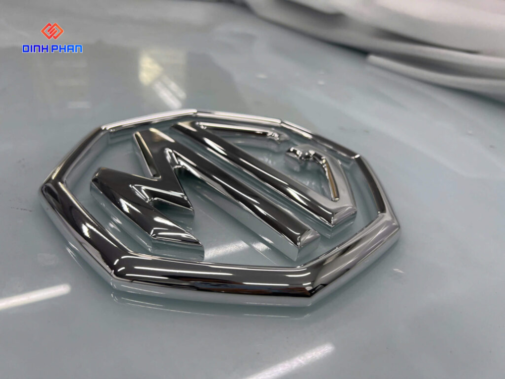 xi ma crom logo MG
